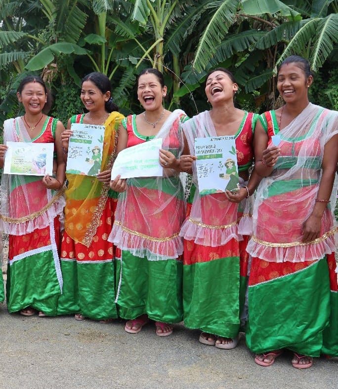Women celebrating with course certificates